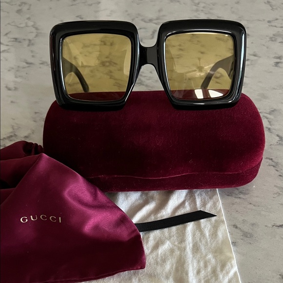 Gucci Women's Sunglasses with Black Frame and Gold Lenses - Picture 1 of 7